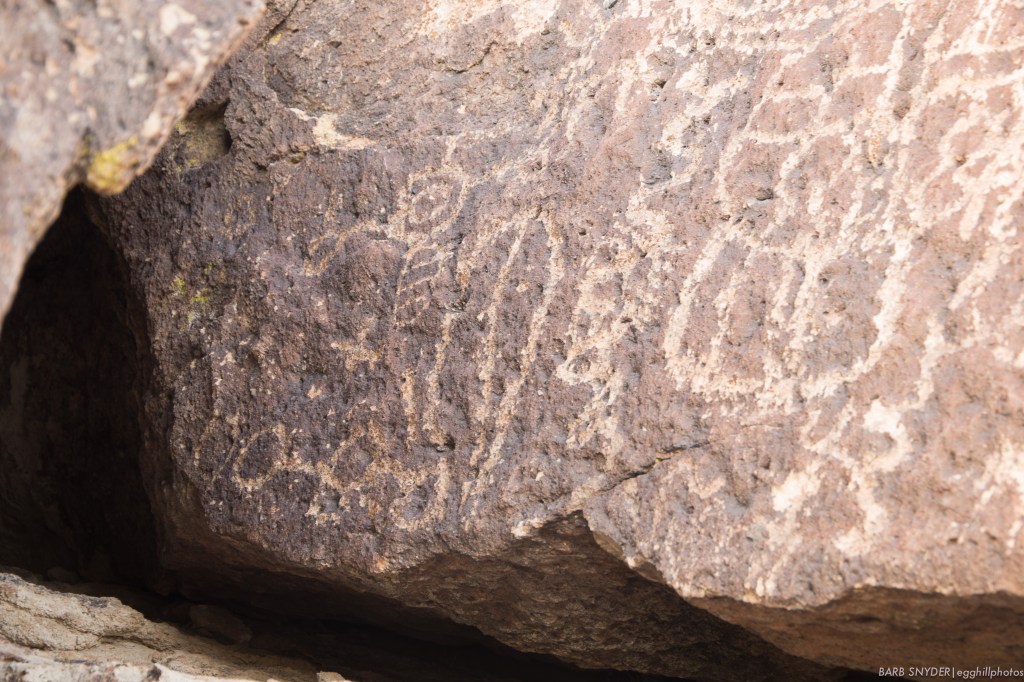 Spaceman - on the left, I see a helmeted (with antennae) spaceman in a spacesuit!