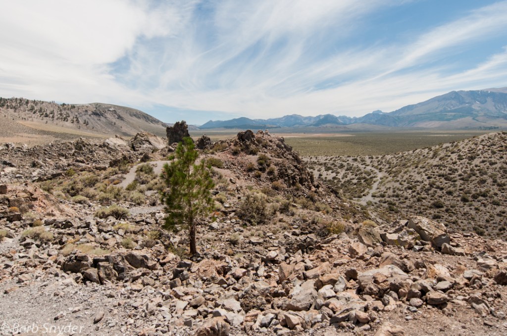 This view looks south away from the lake. Three tips of volcanos with blown-off tops are on the left.