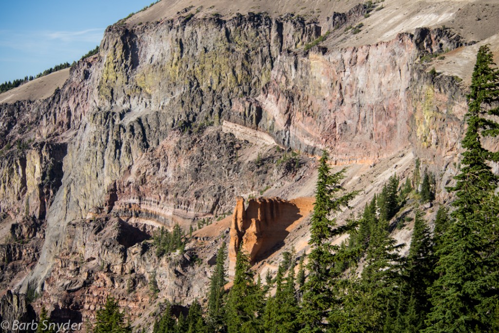 The coppery color on this slope is ash from previous eruptions, now becoming eroded.